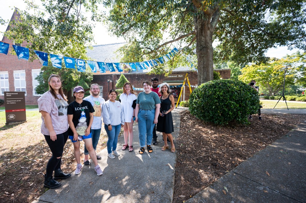 Art students hang cyanotype installment on Sept 29, 2021 outside Hammond Hall.